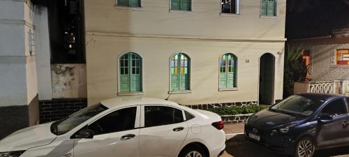a white car parked in front of a building at Casa LV 2 in Lençóis