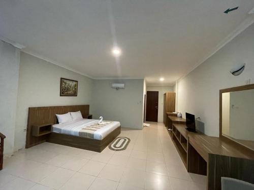Postel nebo postele na pokoji v ubytování rajaampatguesthouse