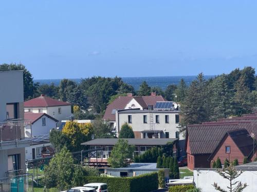 a view of a city with houses and cars at Perła Mórz 74 in Sianozety