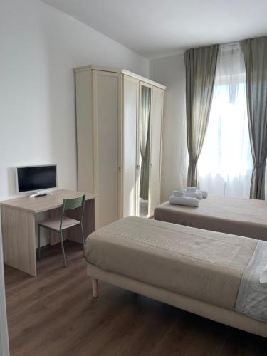 Postel nebo postele na pokoji v ubytování amoR Tempora