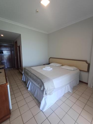 a bedroom with a large bed in a room at Flat Costa Mar in Recife