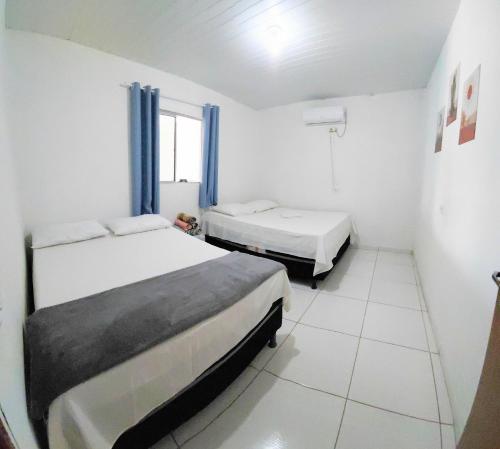 Postel nebo postele na pokoji v ubytování Pousada Aconchego Sol e Mar