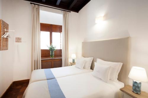 Ένα ή περισσότερα κρεβάτια σε δωμάτιο στο Apartamentos Casa del Aceite