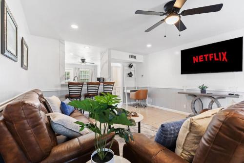a living room with a couch and a tv at NEW Medical Professional Home Near Scott & White Medical and McClains Children Hospital in Temple