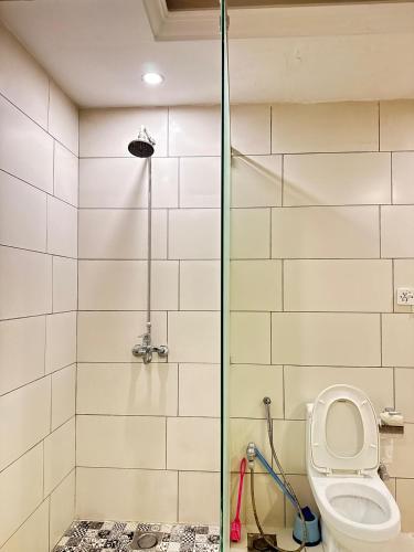 a bathroom with a shower and a toilet at Fior Residence 2BHK in Rawalpindi