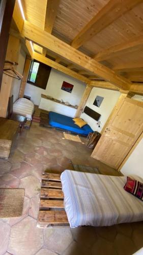 a living room with a couch and a table in a room at Agriturismo La Caraffara sull'Etna in Puntalazzo