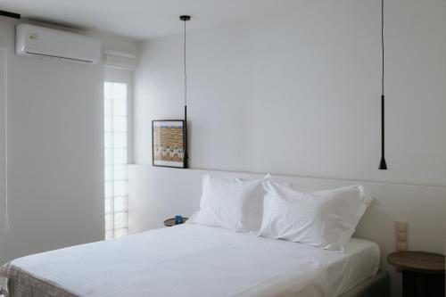 Ένα ή περισσότερα κρεβάτια σε δωμάτιο στο The Urban Living