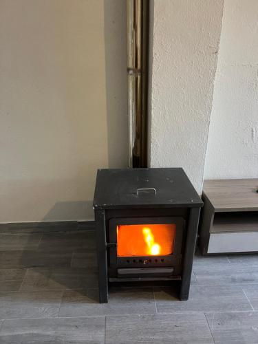 a stove sitting on the floor in a room at Casa Rural Las Eras de Campotejar in Campotéjar