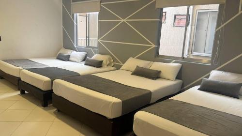 Postel nebo postele na pokoji v ubytování Hospedaje, Medellín,Turismocolombia-fit,Laureles,Estadio