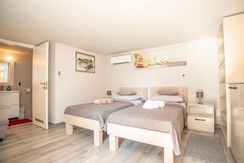 Postel nebo postele na pokoji v ubytování Villa Bandic