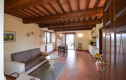 a living room with a couch and a table at Seranna 1 in Papiano