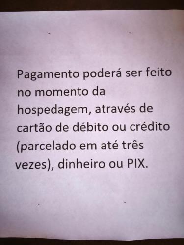ein weißes Papier mit den Worten Paparazzo Pokereria Ser Mon in der Unterkunft Pousada Diva in Resende Costa