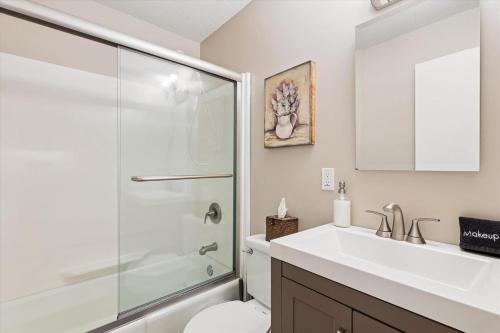 a bathroom with a shower and a sink and a toilet at Edgemont C1 in Killington Village
