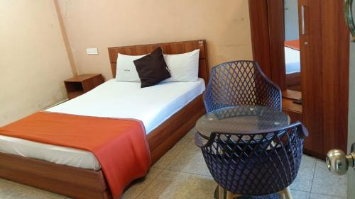 Ένα ή περισσότερα κρεβάτια σε δωμάτιο στο Tamar Residency