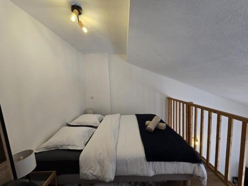 Ένα ή περισσότερα κρεβάτια σε δωμάτιο στο T1 bis Proche Cern Parking Privé