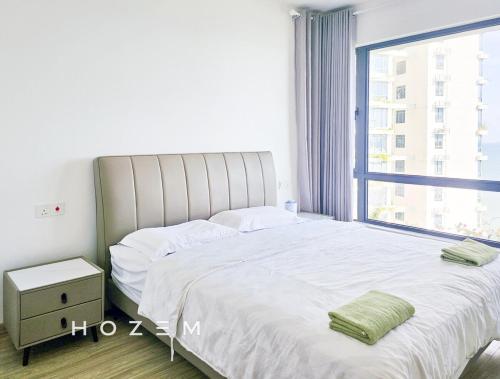 a bedroom with a large bed with a large window at 2BR2B Hozem JB1605 Apartment Forest City in Gelang Patah