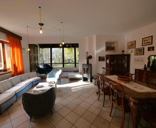 a living room with a couch and a table at Ca di Nà in Entracque