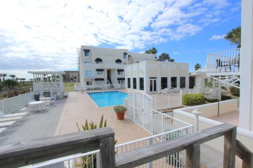 a view of a house with a swimming pool at Oceanfront 2br2b, Ocean Views, Heated Pool, Spa in Cape Canaveral