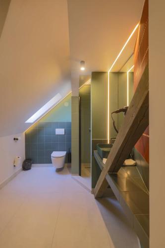 a bathroom with a sink and a toilet at Céhes Guesthouse in Târgu Secuiesc