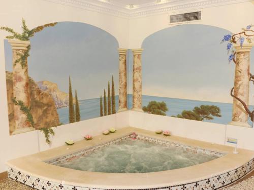 a hot tub in a room with a painting at Villa de Maître 6 Chambres avec Piscine et Jacuzzi - FR-1-768-119 in Roquebrune-sur-Argens