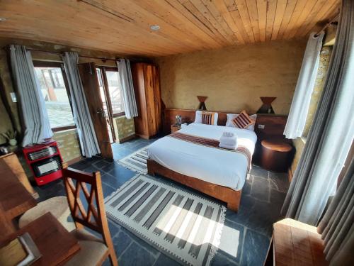 an aerial view of a bedroom with a bed at Pumdikot Mountain Lodge in Kāskī