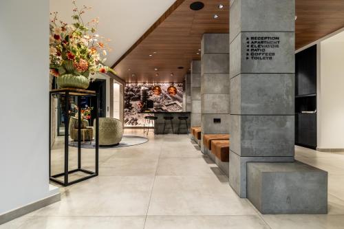 a lobby of a building with a wall at BizStay Toren van Oud in The Hague