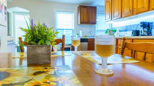 a table with two wine glasses on top of it at 3 BR Southside Pad - Sleeps 8 - Amazing Location in Pittsburgh