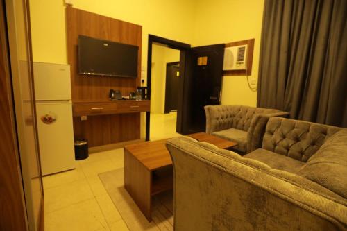 Η κουζίνα ή μικρή κουζίνα στο منازل الحساء للشقق الفندقية