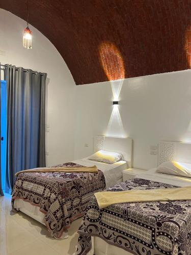 Postel nebo postele na pokoji v ubytování Paradise guest house