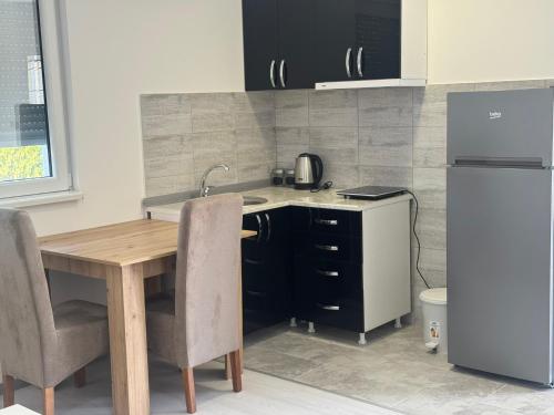 Η κουζίνα ή μικρή κουζίνα στο Elena Airport Apartments