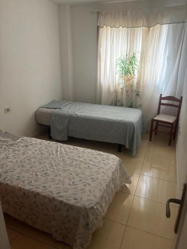 Postel nebo postele na pokoji v ubytování Tenerife Sur Relax