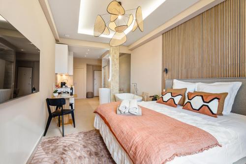 a bedroom with a large bed with a chandelier at Nice Renting - HUGO - Luxury Honeymoon Suite Terrace Park View Free Parking in Nice