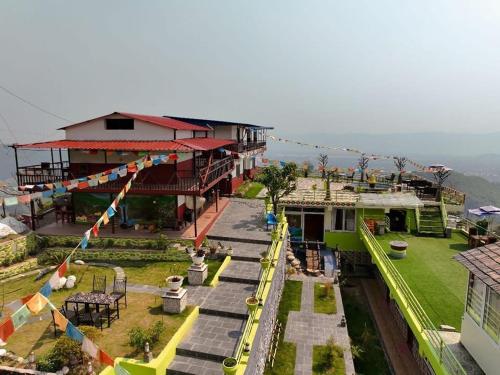 a house with a toy train in front of it at Kahun Danda Resort in Pokhara