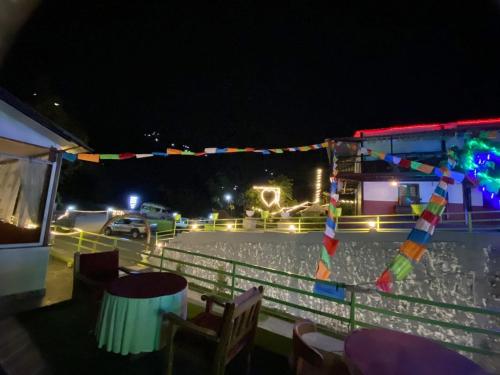a party on a boat at night with lights at Kahun Danda Resort in Pokhara
