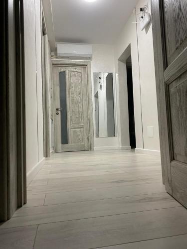 an empty hallway with a door in a building at Privilege in Tecuci