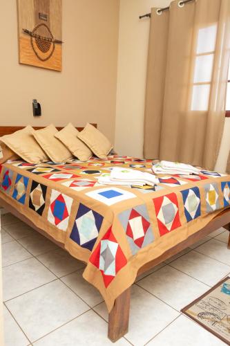 Postel nebo postele na pokoji v ubytování Hotel Estalagem Mineira Cambuí MG