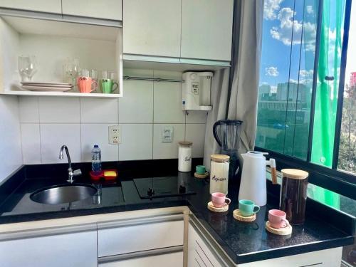 Köök või kööginurk majutusasutuses Garvey 210 Studio Esplanada By Hospede Fácil