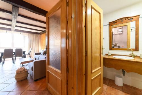 a bathroom with a sink and a mirror at Chalet Copos Nevados by Surynieve in Sierra Nevada