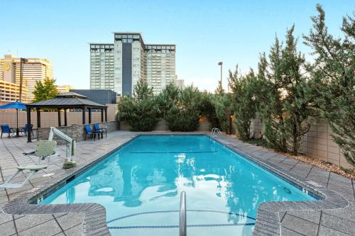 a large swimming pool with a city skyline in the background at WorldMark Reno in Reno