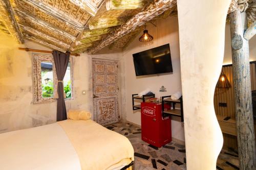 Un televizor și/sau centru de divertisment la Hotel Glamping La Polka