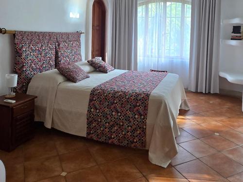 Ένα ή περισσότερα κρεβάτια σε δωμάτιο στο Villa Bruga en Samara Rocks