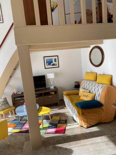 a living room with a bed and a table at Maison in Fayence