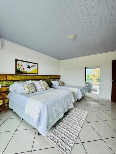 Ένα ή περισσότερα κρεβάτια σε δωμάτιο στο Casa Rústica e Moderna em Búzios!