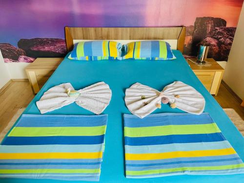 Ein Bett oder Betten in einem Zimmer der Unterkunft Horizont Herceg Novi