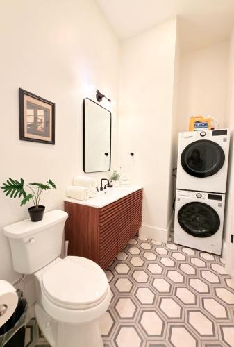 a bathroom with a toilet and a sink at Providence City Center 1BR, Full Kitchen, Walk to Convention Center & PPAC in Providence