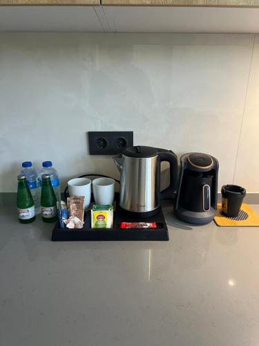 a tray with a coffee maker on a kitchen counter at Mirşah Suit in Bezkesen