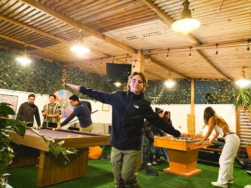 a man standing in front of a ping pong table at The Point Miraflores, Lima in Lima