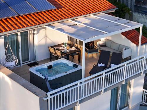 an overhead view of a hot tub on a roof at Villa ELLA ESTELLE with a heated pool, hot tub, sauna in Mimice