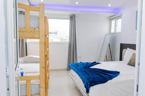 a bedroom with two bunk beds and a window at Sea View Big Lanche in Praia Baixo