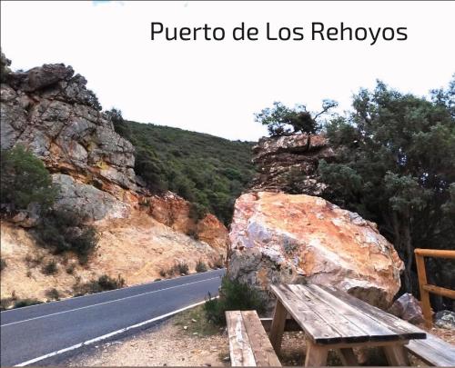 a wooden bench sitting on the side of a road at ALOJAMIENTO TURISTICO LAS SOLANERAS in Solana del Pino